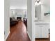 View from hallway into living room with white trim fireplace and hardwood floors at 1540 Cedar Bluff Trl, Marietta, GA 30062