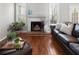 Bright living room featuring a brick fireplace and windows at 1540 Cedar Bluff Trl, Marietta, GA 30062