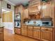 Close-up on kitchen with custom cabinets, built-in stainless appliances, and a modern cooktop at 200 Suffolk Way, Mcdonough, GA 30252