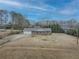 An aerial view of this house shows mature trees, long driveway and large yard at 772 Garner Sw Rd, Lilburn, GA 30047