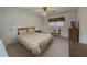 Bedroom features neutral carpet, closet doors, window, and a ceiling fan at 772 Garner Sw Rd, Lilburn, GA 30047