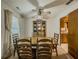 Traditional dining room with ceiling fan, classic furnishings and window view at 772 Garner Sw Rd, Lilburn, GA 30047