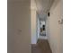 Hallway featuring neutral walls and carpet leading to other rooms in the home at 772 Garner Sw Rd, Lilburn, GA 30047