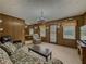 Comfortable living room with wood accents, carpet flooring, and views of the outdoors at 772 Garner Sw Rd, Lilburn, GA 30047
