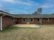 Spacious backyard patio perfect for outdoor living with beautiful yard and home exterior view at 772 Garner Sw Rd, Lilburn, GA 30047