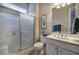 Bright bathroom featuring a tiled shower with glass door, and a modern vanity at 104 Big Meadows Dr, Canton, GA 30114