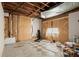 Unfinished basement space awaiting customization, featuring checkerboard flooring and exposed elements at 1364 Tsali Trl, Morrow, GA 30260