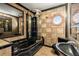 Unique bathroom featuring tiled walls, enclosed stand up shower and modern fixtures at 1364 Tsali Trl, Morrow, GA 30260