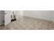 Unfinished basement area with tiled flooring and a toilet in the corner at 1364 Tsali Trl, Morrow, GA 30260