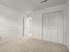 The bedroom has carpet floors, white walls, trim, and doors at 1364 Tsali Trl, Morrow, GA 30260
