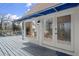 Exterior view from the deck with awning over door with decorative glass and stone accents at 1364 Tsali Trl, Morrow, GA 30260