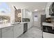 Updated white kitchen with stainless steel appliances, white countertops, and an undermount sink at 1364 Tsali Trl, Morrow, GA 30260