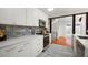 Renovated kitchen with stainless steel appliances, subway tile backsplash and white cabinetry at 1364 Tsali Trl, Morrow, GA 30260