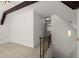The loft has carpet floors, a metal railing, and two levels of stairs at 1364 Tsali Trl, Morrow, GA 30260