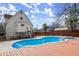 Backyard pool boasts a wooden deck and access to second story of home at 1364 Tsali Trl, Morrow, GA 30260