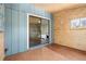 The room has wooden floors and walls, and a sliding glass door to the bedroom at 1364 Tsali Trl, Morrow, GA 30260