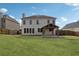 Back of house featuring large lawn, windows, covered patio and fenced yard at 2815 Chandler Grove Dr, Buford, GA 30519