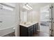 Bathroom with dual vanity, tile floor, and a tub and shower combo at 2815 Chandler Grove Dr, Buford, GA 30519