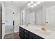 Bathroom with dual vanity, tile floor, and several linen closets at 2815 Chandler Grove Dr, Buford, GA 30519