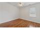Empty bedroom with wood floors, ceiling fan, and window at 2815 Chandler Grove Dr, Buford, GA 30519