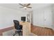 Bedroom featuring hardwood floors, a ceiling fan and a minimalist workspace at 2815 Chandler Grove Dr, Buford, GA 30519