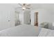 Bright bedroom with a ceiling fan, closet and adjacent doorways at 2815 Chandler Grove Dr, Buford, GA 30519