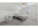 Cozy bedroom featuring neutral tones, ceiling fan, and a sunny window at 2815 Chandler Grove Dr, Buford, GA 30519
