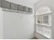 Walk-in closet with built in shelving, a window and space for ample storage at 2815 Chandler Grove Dr, Buford, GA 30519