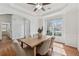 Elegant dining room with tray ceiling, wainscoting, and a stylish chandelier above the table at 2815 Chandler Grove Dr, Buford, GA 30519