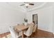 Elegant dining room with tray ceiling, wainscoting, and a stylish chandelier above the table at 2815 Chandler Grove Dr, Buford, GA 30519
