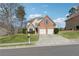 Attractive two-story home featuring brick accents, well-maintained lawn, and a two-car driveway at 2815 Chandler Grove Dr, Buford, GA 30519