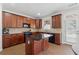 Modern kitchen offers custom cabinetry, stainless steel appliances, a central island, and access to the outdoors at 2815 Chandler Grove Dr, Buford, GA 30519