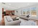 Open living room with lots of natural light that flows into the adjoined eat-in kitchen at 2815 Chandler Grove Dr, Buford, GA 30519