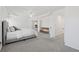 Inviting main bedroom with tray ceiling, plush carpet, and a doorway leading to other rooms for convenience at 2815 Chandler Grove Dr, Buford, GA 30519