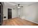 Spacious bedroom with hardwood flooring, a closet, and a view to the bathroom at 2873 Sylvan Rd, East Point, GA 30344