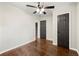 Bedroom with hardwood floors, a ceiling fan, and ample closet space with neutral paint at 2873 Sylvan Rd, East Point, GA 30344