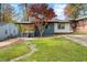 Charming renovated single-story home with mature tree and freshly landscaped front yard at 2873 Sylvan Rd, East Point, GA 30344