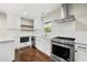 Well-lit kitchen with white cabinets, stainless steel appliances, and subway tile backsplash at 2873 Sylvan Rd, East Point, GA 30344