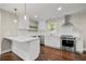 Modern kitchen featuring white cabinets, stainless steel appliances, and a center island with quartz countertop at 2873 Sylvan Rd, East Point, GA 30344