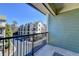 Comfortable balcony offering an unobstructed view of nearby townhomes and street at 6444 Chariot St, Atlanta, GA 30328