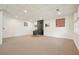 Large basement with updated lighting, wood burning stove, and a neutral color palette at 6875 Sunny Brook Ln, Atlanta, GA 30328