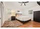 Well-lit bedroom with hardwood floors, a neutral color scheme, and closet storage at 6875 Sunny Brook Ln, Atlanta, GA 30328