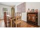Cozy dining room featuring a wooden table, art, and cabinet with wine storage at 6875 Sunny Brook Ln, Atlanta, GA 30328