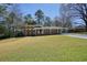 Charming home with well-manicured front lawn and covered carport, offering both curb appeal and convenience at 6875 Sunny Brook Ln, Atlanta, GA 30328