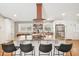 Spacious kitchen with a large island, copper sink, stainless appliances, and wooden countertops for charm and functionality at 6875 Sunny Brook Ln, Atlanta, GA 30328