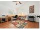 Spacious home office featuring hardwood floors, a ceiling fan, and a desk at 6875 Sunny Brook Ln, Atlanta, GA 30328