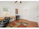 Bright home office with hardwood floors, modern desk, and large window at 6875 Sunny Brook Ln, Atlanta, GA 30328