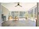 Sun-drenched sunroom with tiled floors, floor-to-ceiling windows, and space for relaxing or entertaining at 6875 Sunny Brook Ln, Atlanta, GA 30328