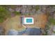 Aerial photo of the community pool with ample parking and surrounding trees at 1715 Branchwood Ct, Powder Springs, GA 30127