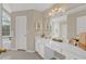 Bright bathroom with large mirror, white cabinets, countertop, and decorative accents at 1715 Branchwood Ct, Powder Springs, GA 30127